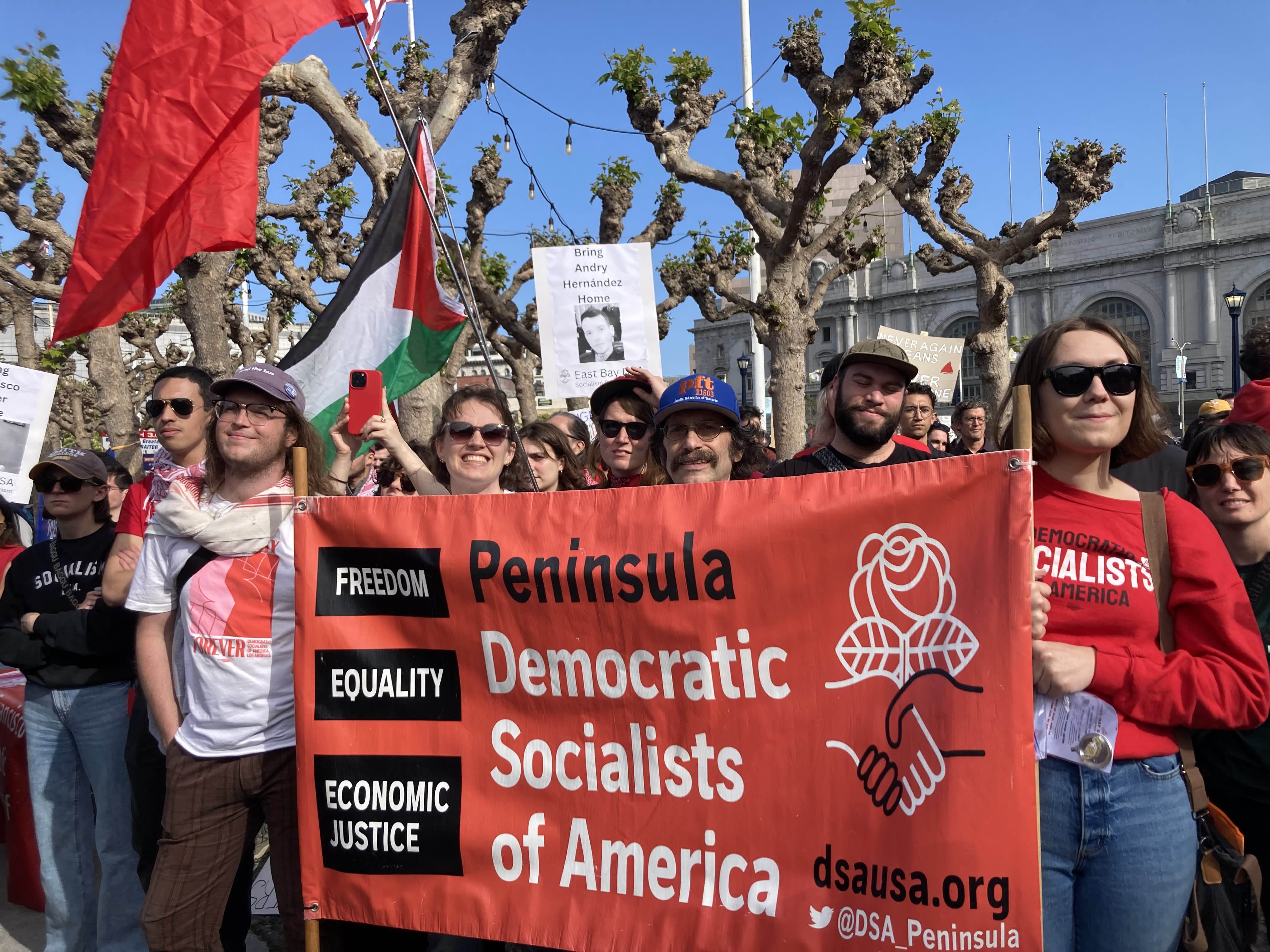 Peninsula DSA members with our banner at May Day 2025 in San Francisco!